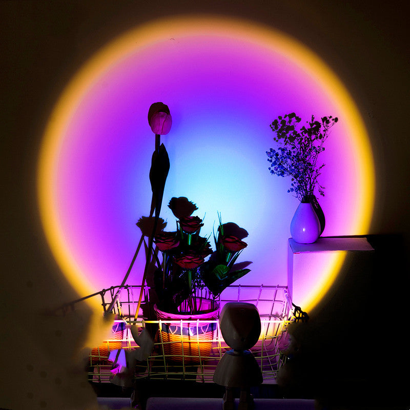 Pookni astronaut sunset projector light casting a warm rainbow and sunset red atmosphere on a bedroom wall
